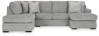 Grey corner chaise sectional sofa with chaise ottoman and throw pillows.