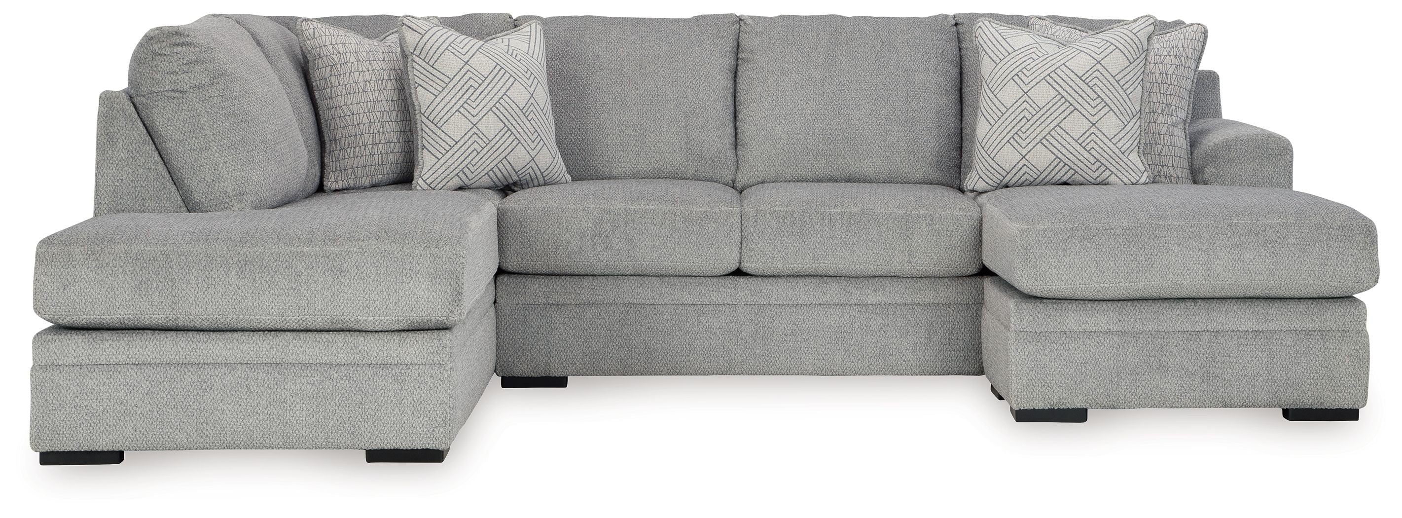 Grey corner chaise sectional sofa with chaise ottoman and throw pillows.