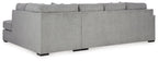 Grey sectional sofa profile view with chaise seat and boxy back cushions.