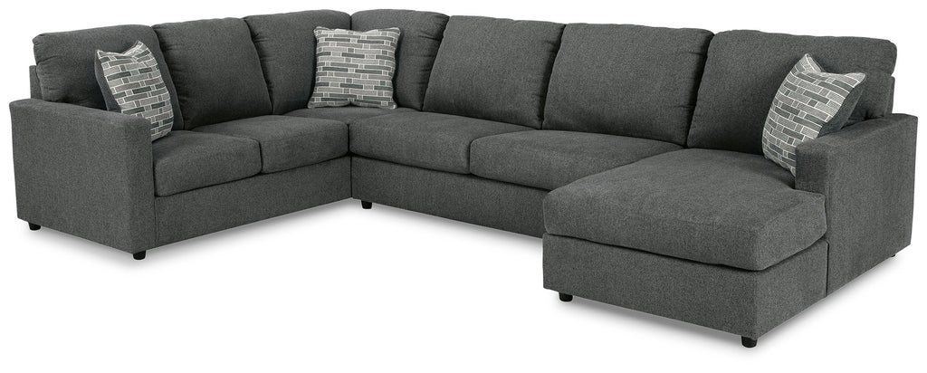 Sectional sofa with corner chaise, dark charcoal upholstery, square arms, with throw pillows
