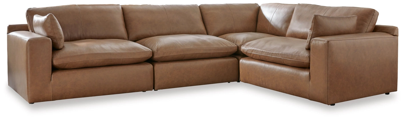 Brown leather sectional sofa with chaise arm and deep seat cushions