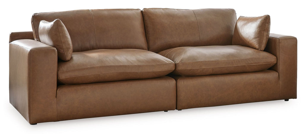 Brown sectional sofa with three seat cushions and square arms