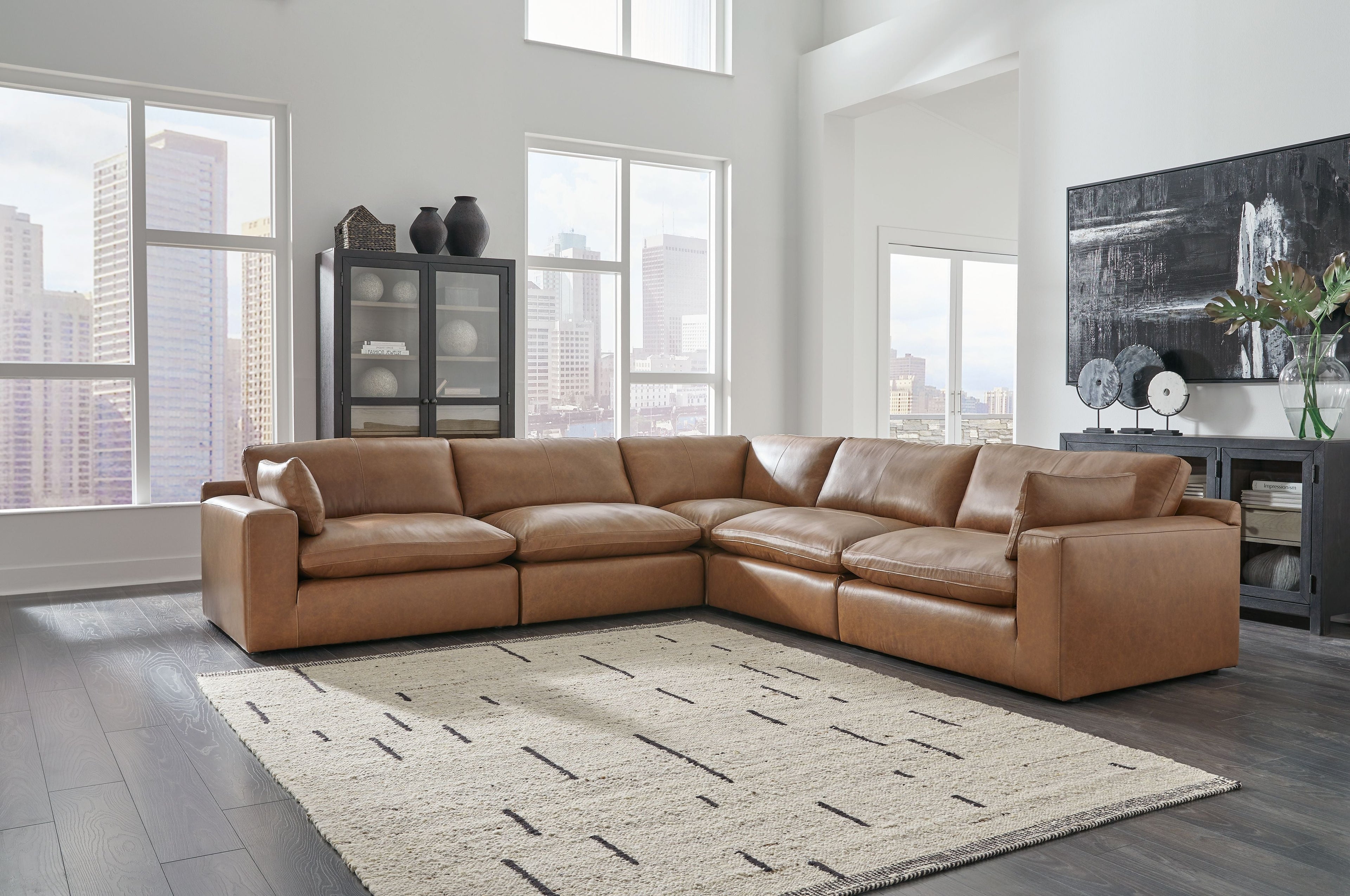Brown leather sectional sofa with corner chaise and multiple seat sections