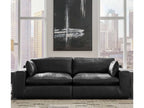Black sectional sofa with chaise-like end, wide arms, and deep seat cushions