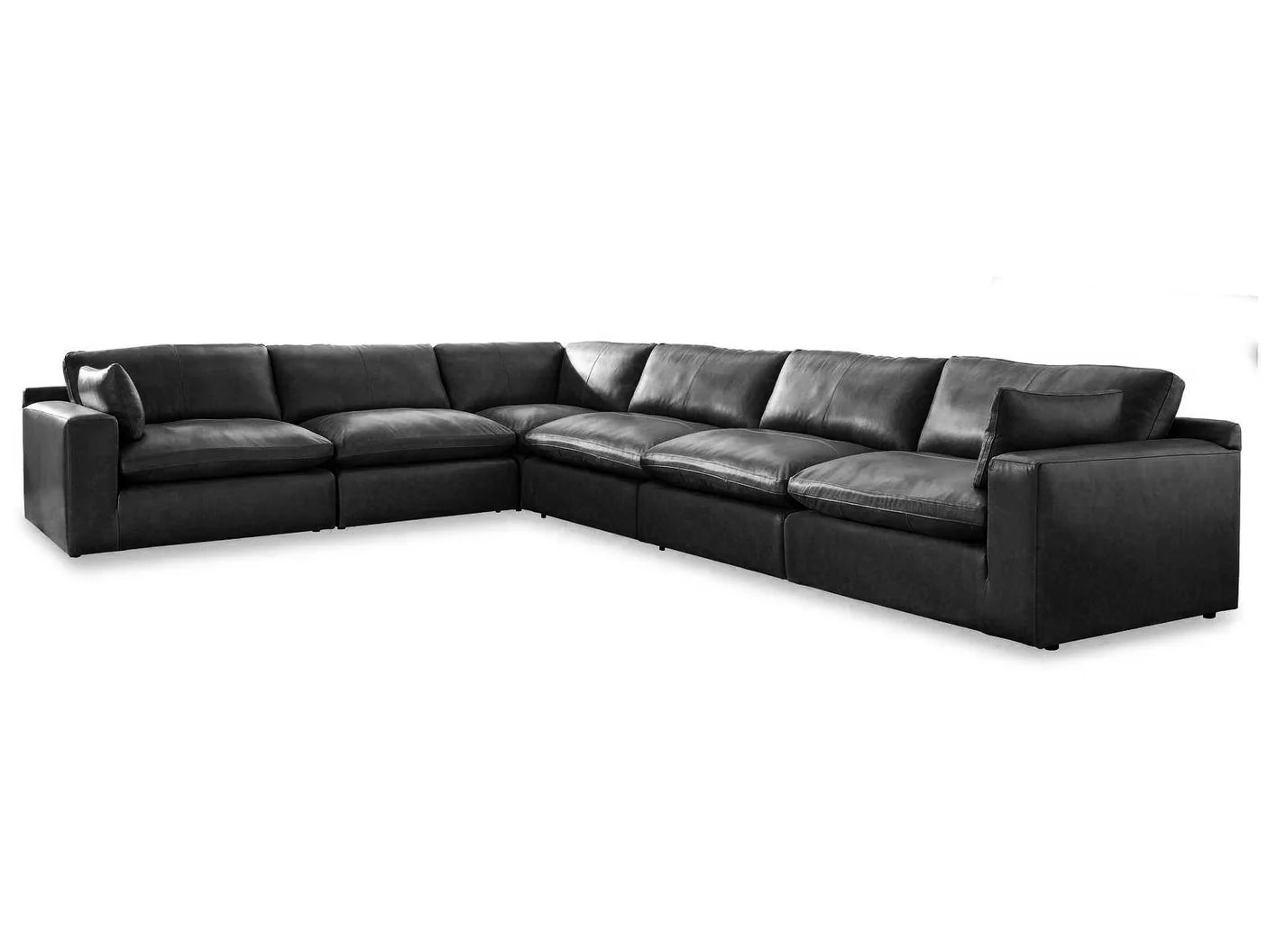 Black sectional sofa L-shape with chaise section, low arms, and padded seat cushions