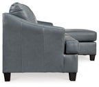 Steel sectional sofa side view with rounded armrest and boxy back cushions