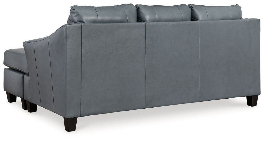 Steel sectional sofa back view with multiple seat and back cushions, gray upholstery