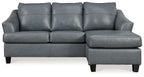 Steel sectional sofa with three seat cushions and padded armrests, gray upholstery