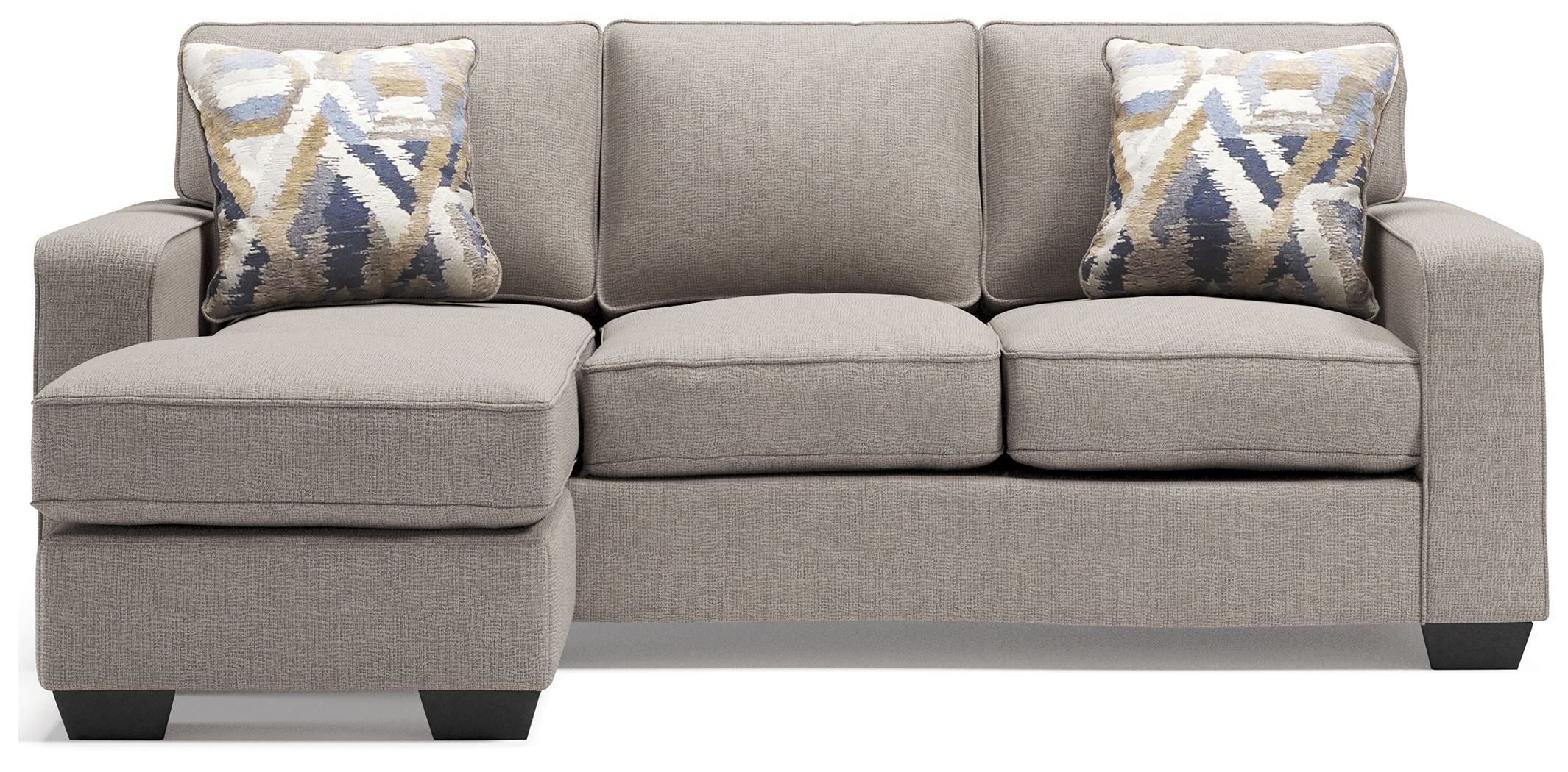 Stone gray sectional sofa with three seat cushions and two patterned accent pillows