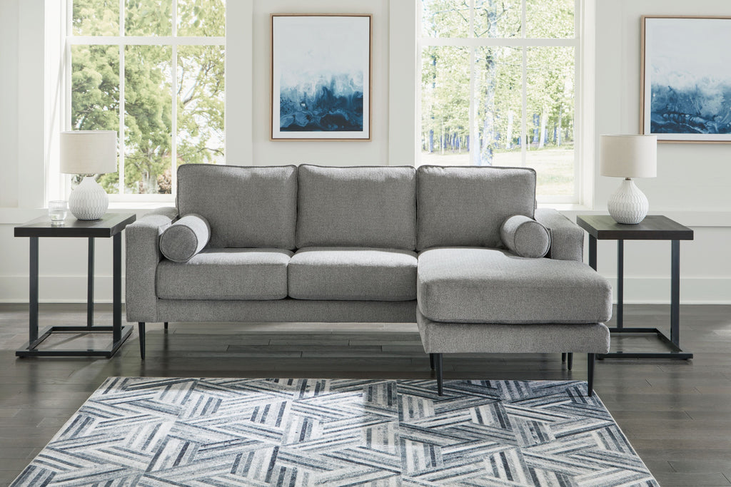 Charcoal sectional sofa with chaise, rounded arms and tufted cushions
