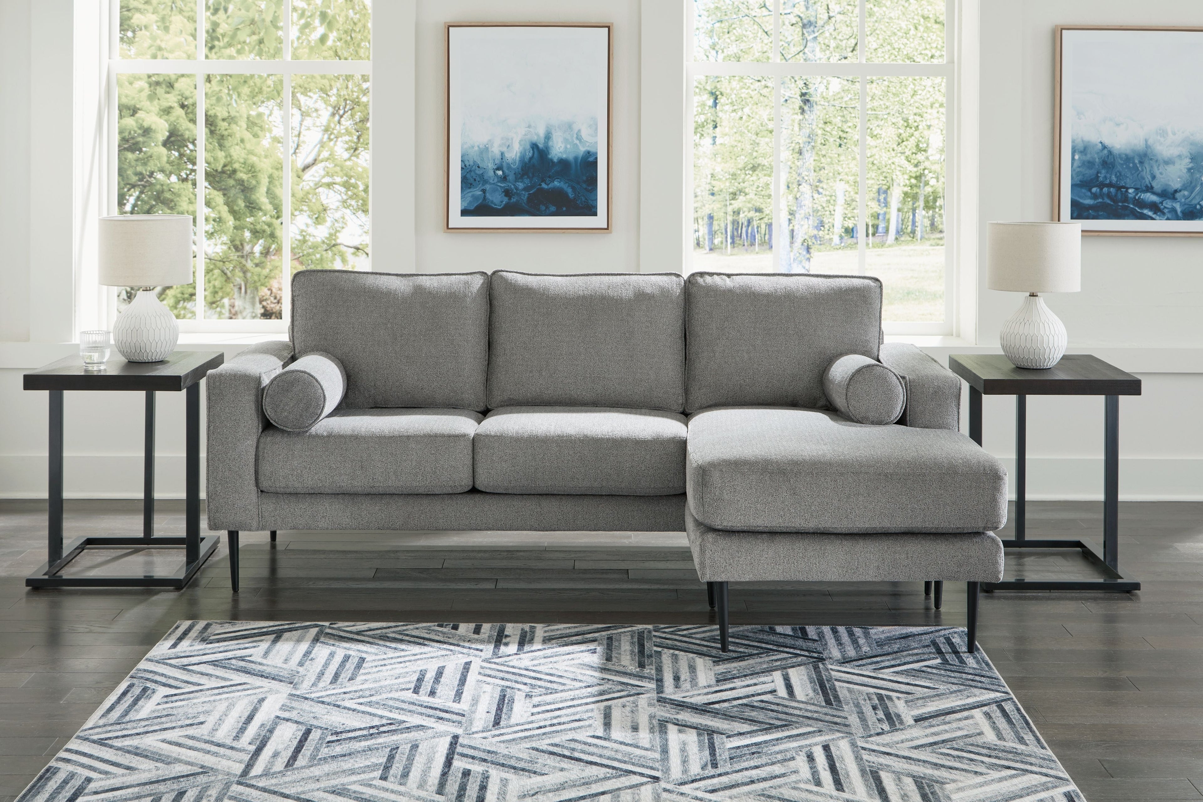 Charcoal sectional sofa with chaise, rounded arms and tufted cushions