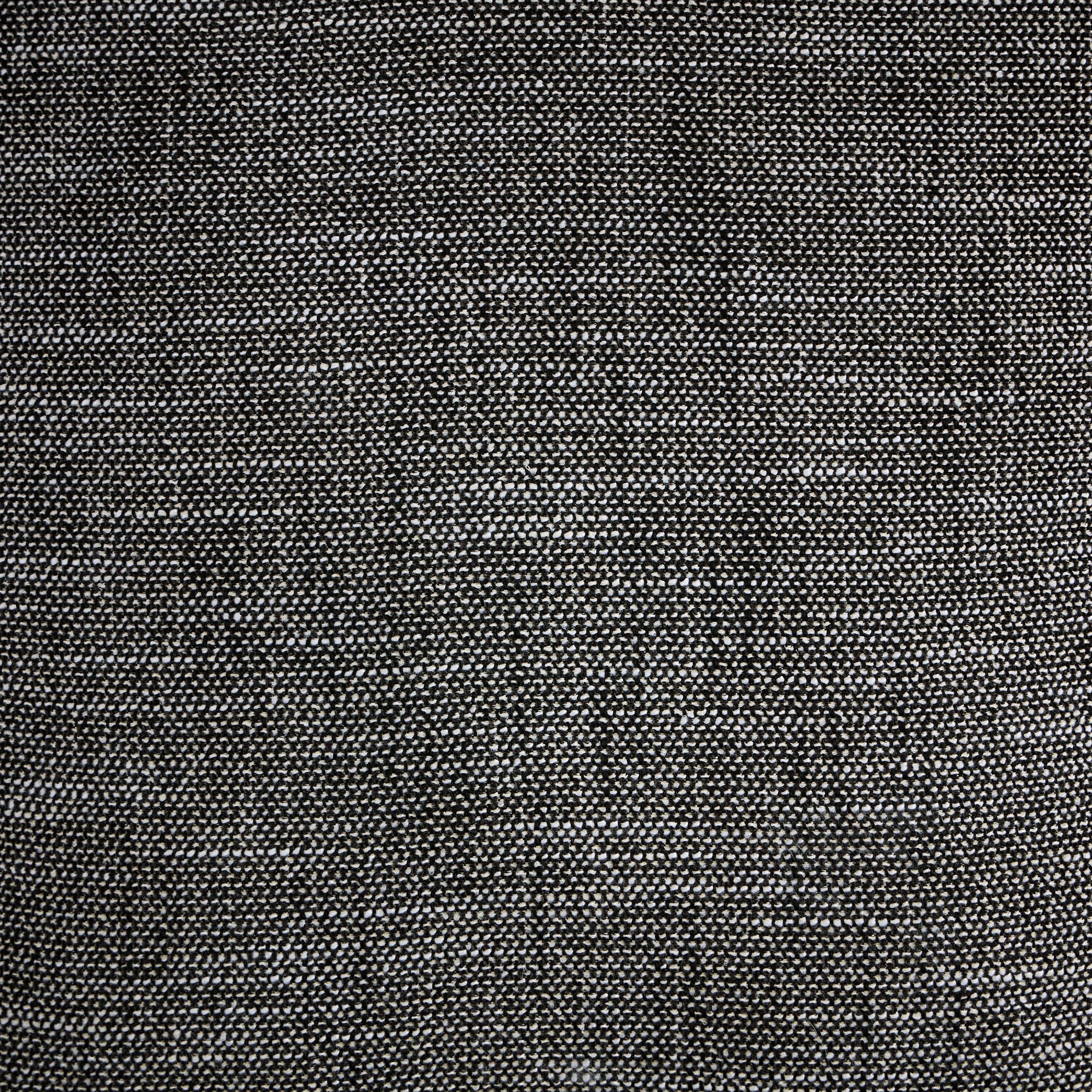 Close-up of woven charcoal fabric texture, dense grid pattern