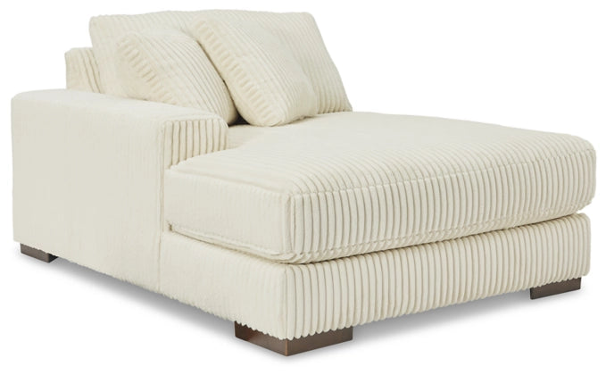 Ivory corduroy sectional sofa with chaise seat cushion and back pillows