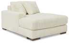 Ivory corduroy sectional sofa with chaise seat cushion and back pillows