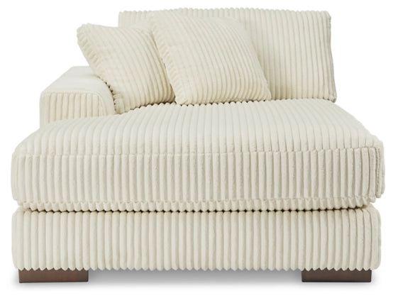 Ivory corduroy sectional sofa chaise with deep seat, segmented cushions, and pillows