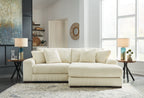 Ivory striped sectional sofa with ottoman-style chaise and square throw pillows