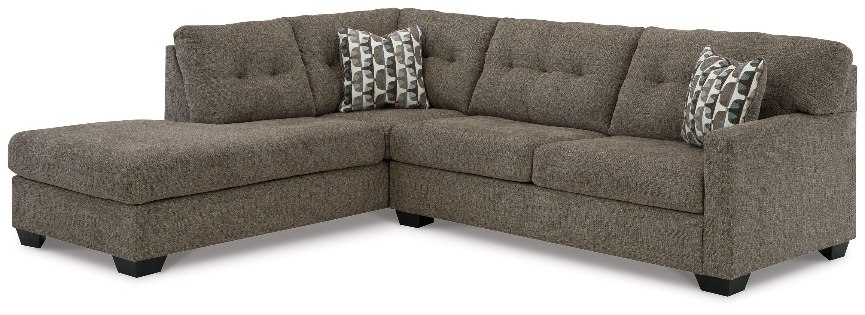 Dark gray sectional sofa with corner chaise and patterned throw pillows