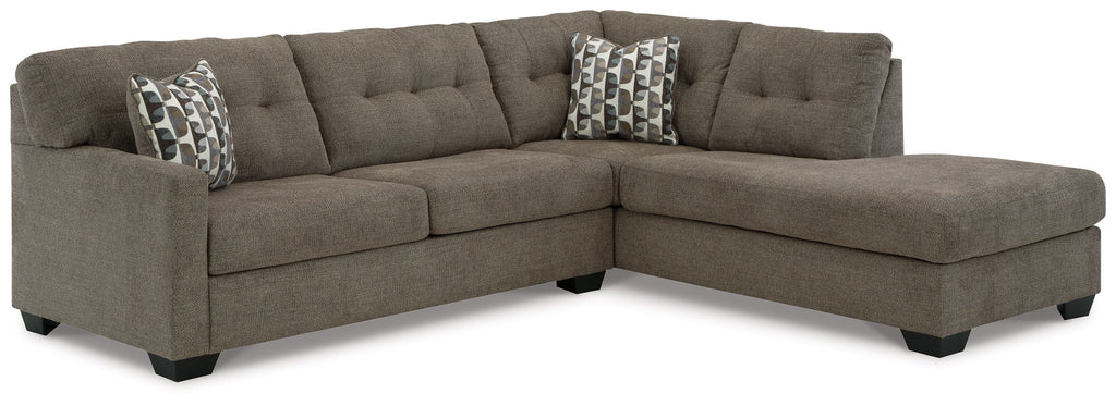 Sectional sofa with tufted back and arms, dark gray fabric, corner chaise and throw pillows