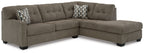 Sectional sofa with tufted back and arms, dark gray fabric, corner chaise and throw pillows