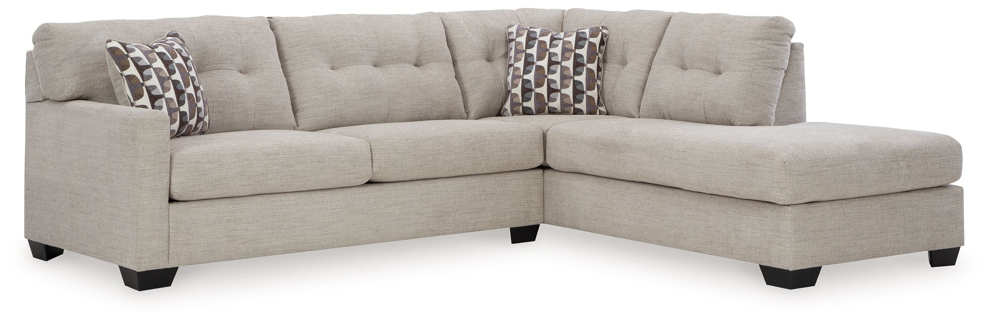 Light gray sectional with corner chaise and patterned accent pillows
