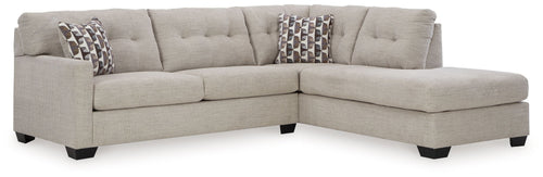 Light gray sectional with corner chaise and patterned accent pillows