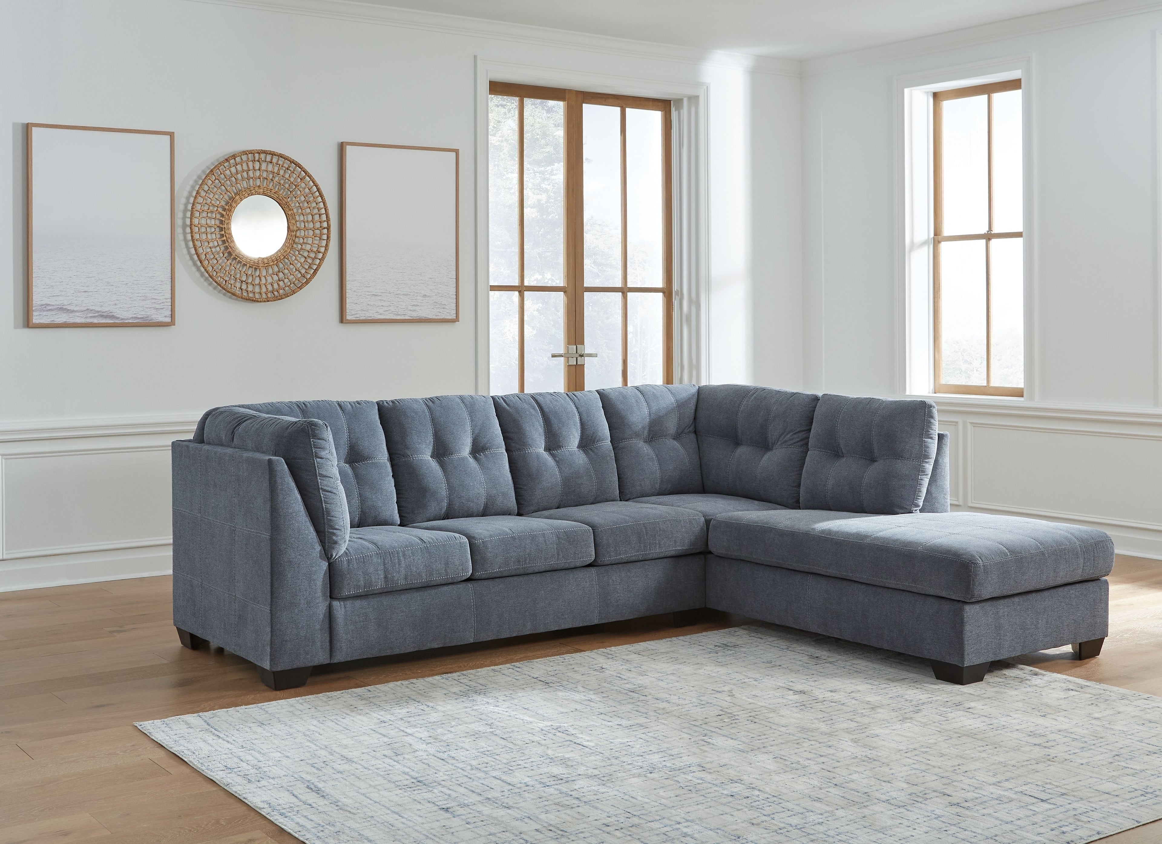 Gray corner chaise sectional sofa with tufted back and bench seat cushions
