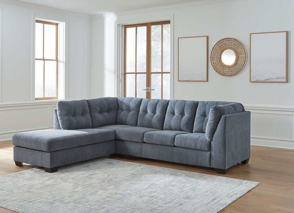 Gray corner chaise sectional sofa with tufted back, wide seats, and chaise ottoman