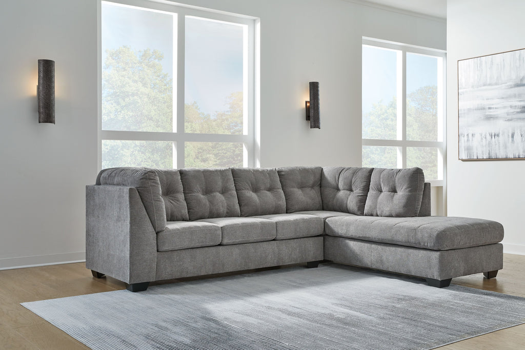 Gray corner chaise sectional sofa with tufted back and chaise lounge section