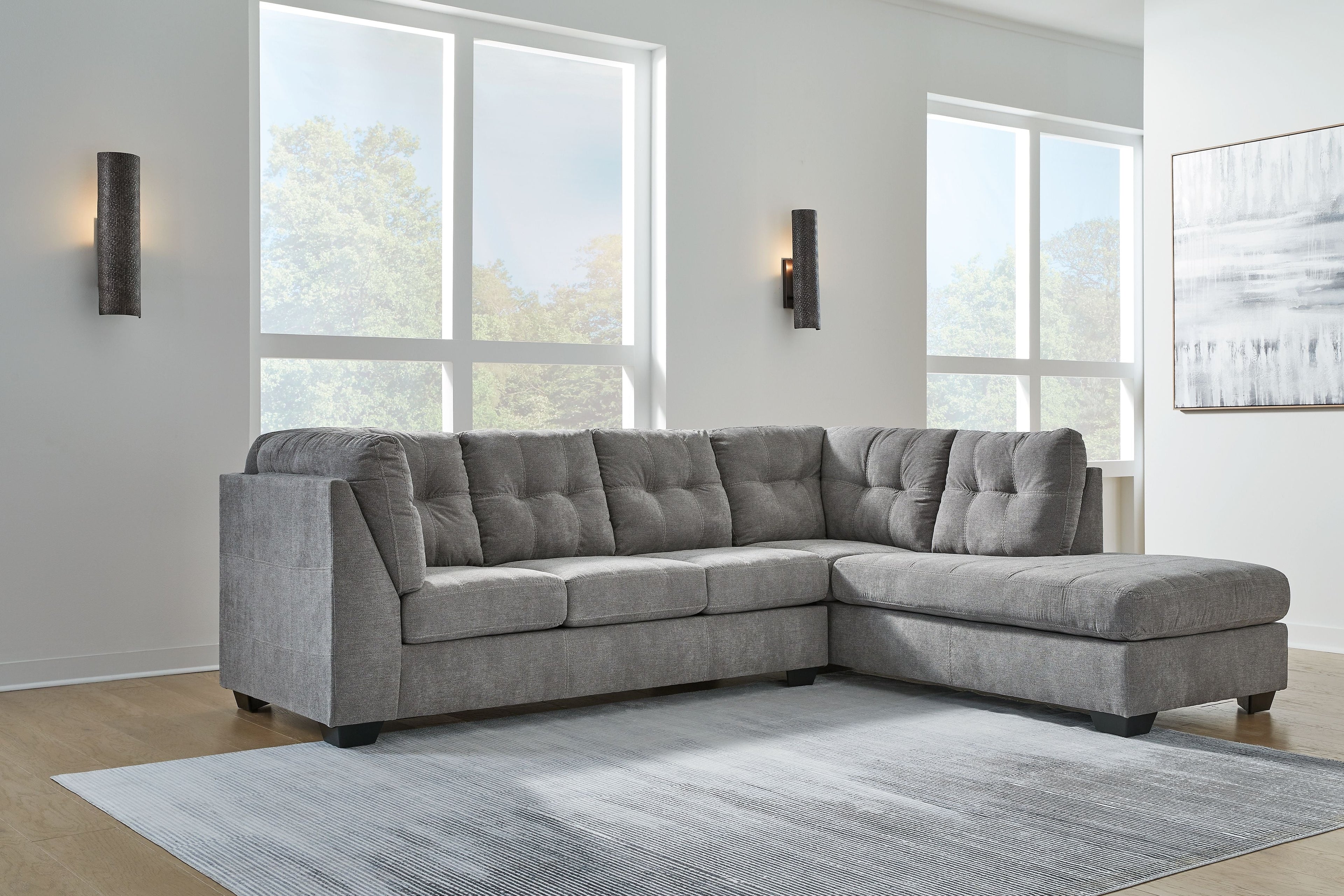 Gray corner chaise sectional sofa with tufted back and chaise lounge section