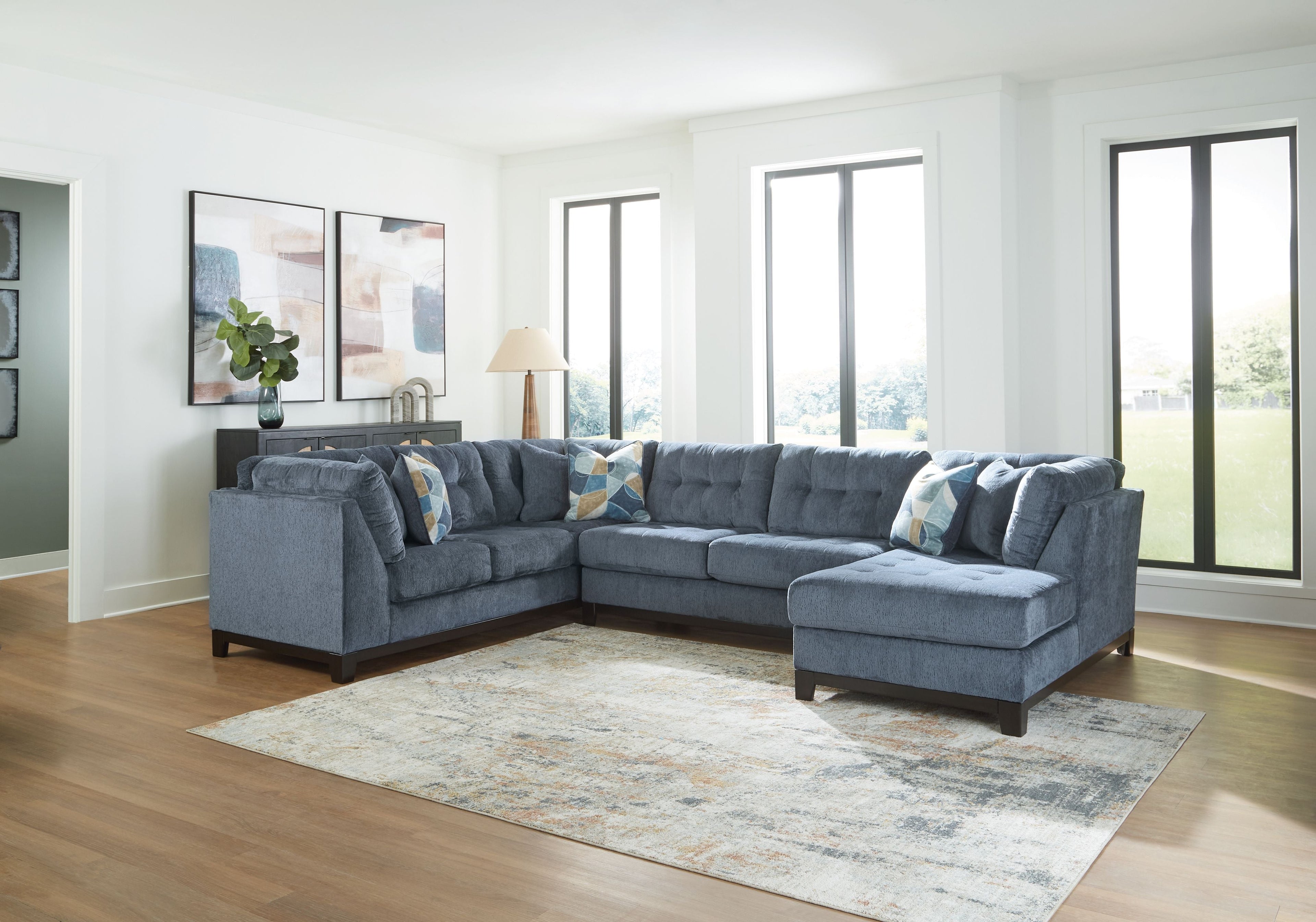 Navy sectional sofa with chaise and matching throw pillows