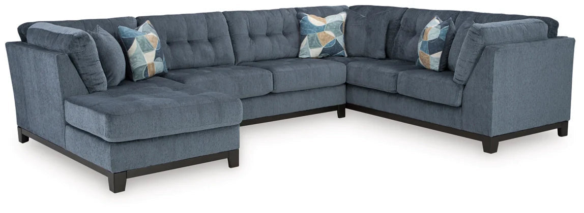Blue sectional sofa with right chaise and patterned accent pillows