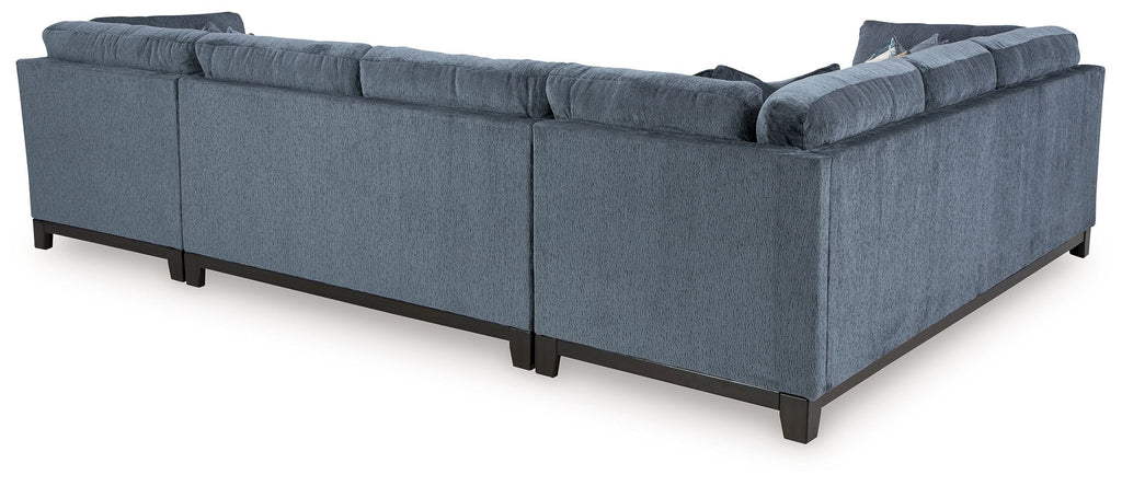 Blue sectional sofa with chaise, boxed arms, and solid seat cushions