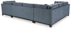 Blue sectional sofa with chaise, boxed arms, and solid seat cushions