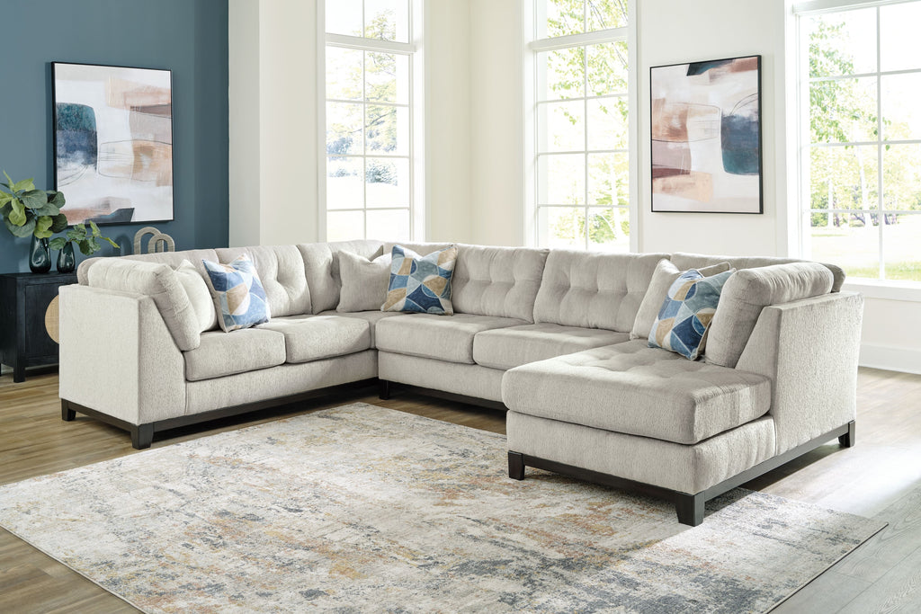 Stone sectional sofa with corner chaise and blue accent pillows