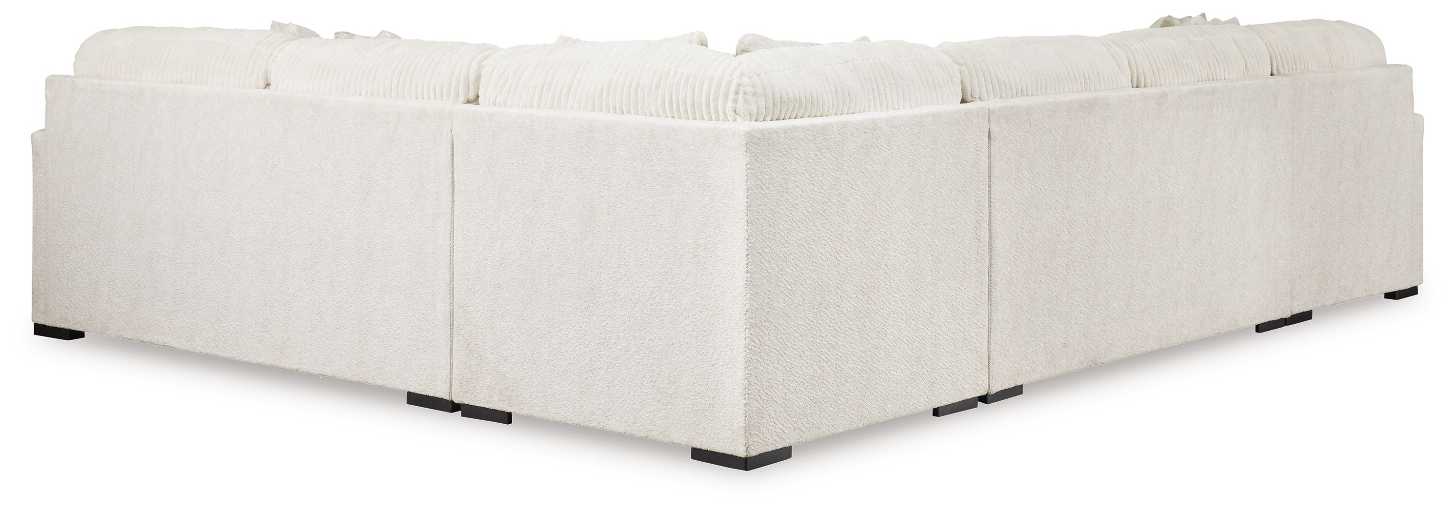 Ivory fabric sectional sofa with boxy arms, square black feet, tight back cushions