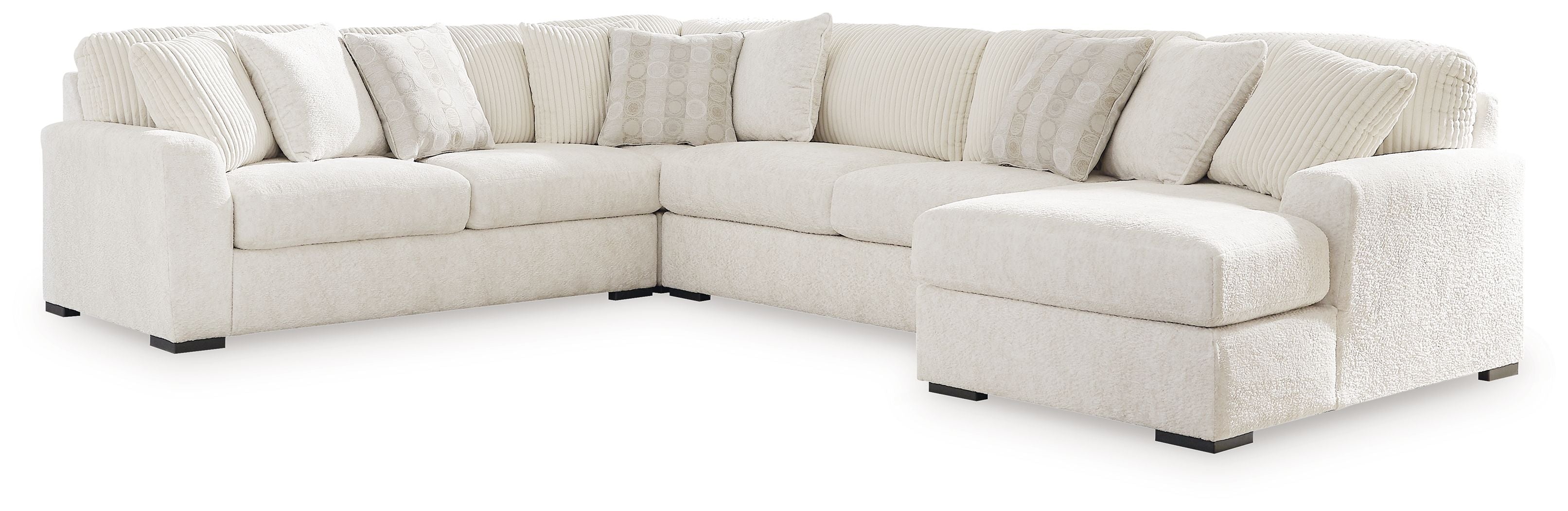 Ivory sectional sofa with corner chaise, soft back cushions, and rounded arm pads