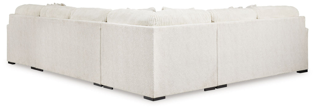 Ivory sectional sofa chaise with upholstered arms and legs, featuring a clean boxy silhouette