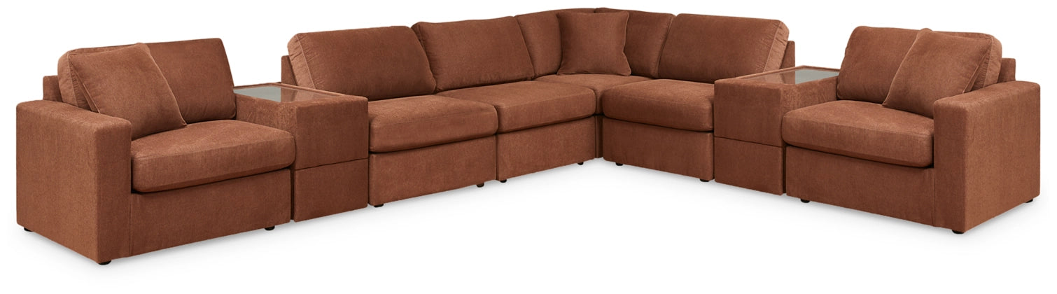Modular sectional sofa in warm brown fabric with square arms and cushioned seats
