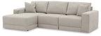 Light gray sectional sofa with chaise and boxed cushions, square arms, tufted back pillows
