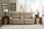 Sand beige power reclining sectional sofa with two-seat center section in a bright living room
