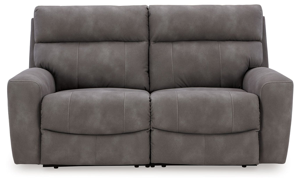 Dark gray power reclining loveseat sofa with two padded seats