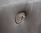 Dark gray upholstery with built-in power control switch and attached cord