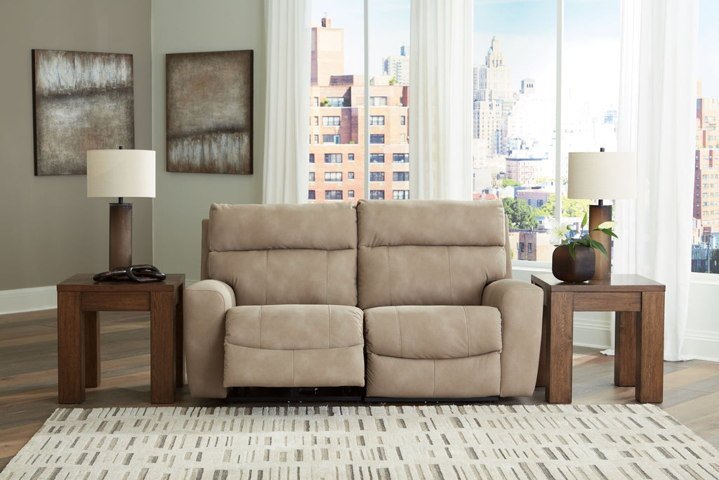 Power reclining loveseat with dual recline seats and padded arms, light beige upholstery