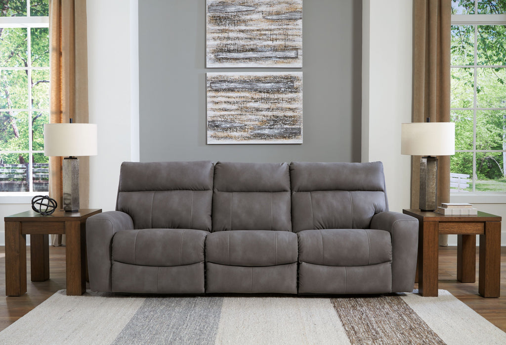 Gray power reclining sectional sofa with three seat sections and padded headrests