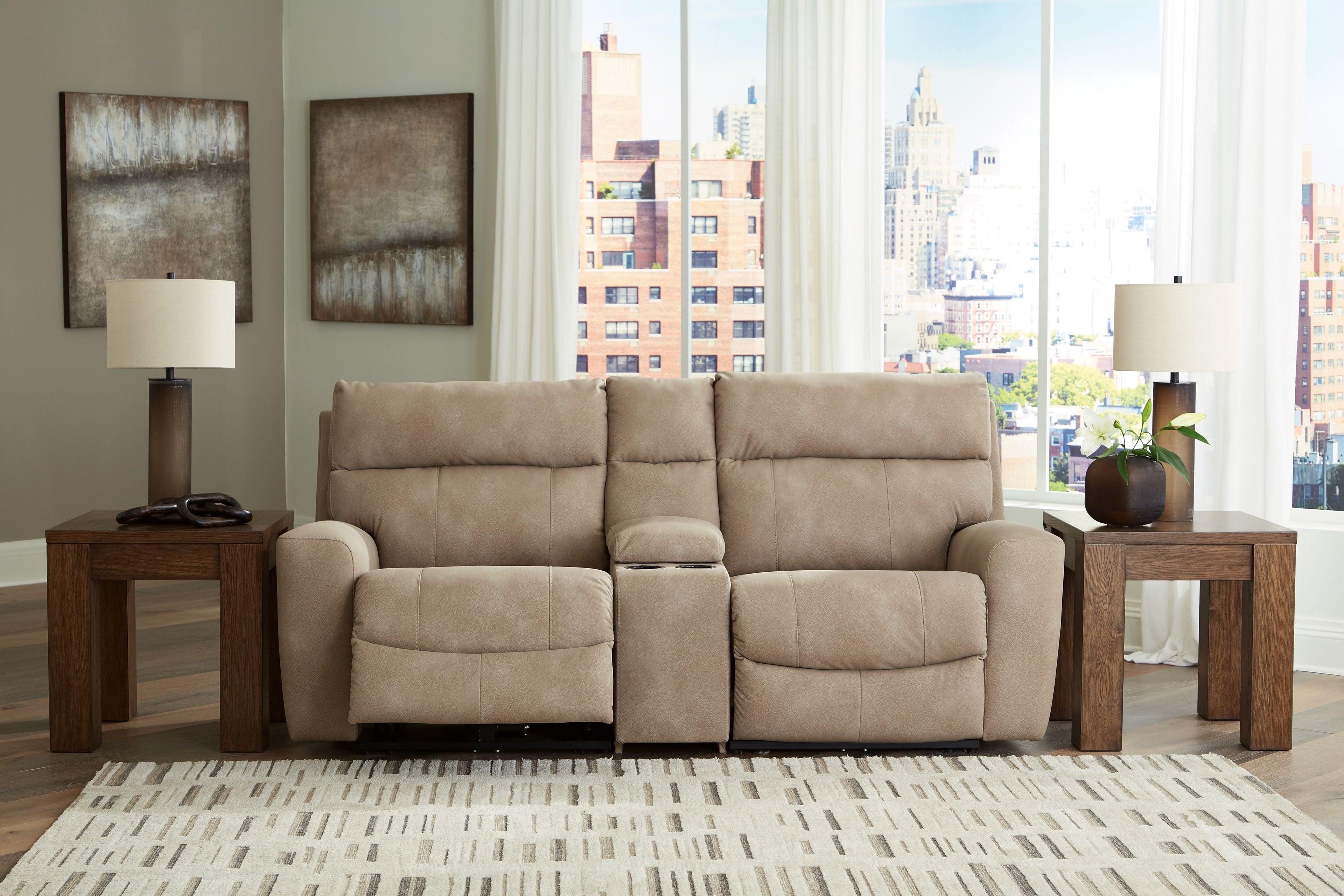 Light beige power reclining sectional with two recliner seats and padded arms