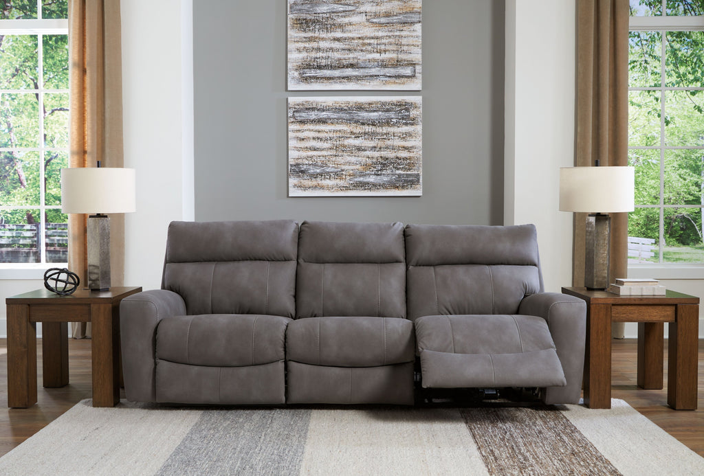 Gray power reclining sectional with three padded seats and extendable footrests