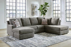 Gray sectional sofa with corner chaise, square armrests, and throw pillows
