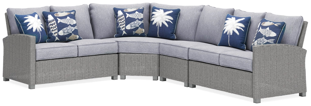 Light gray outdoor sectional sofa with corner and blue patterned pillows