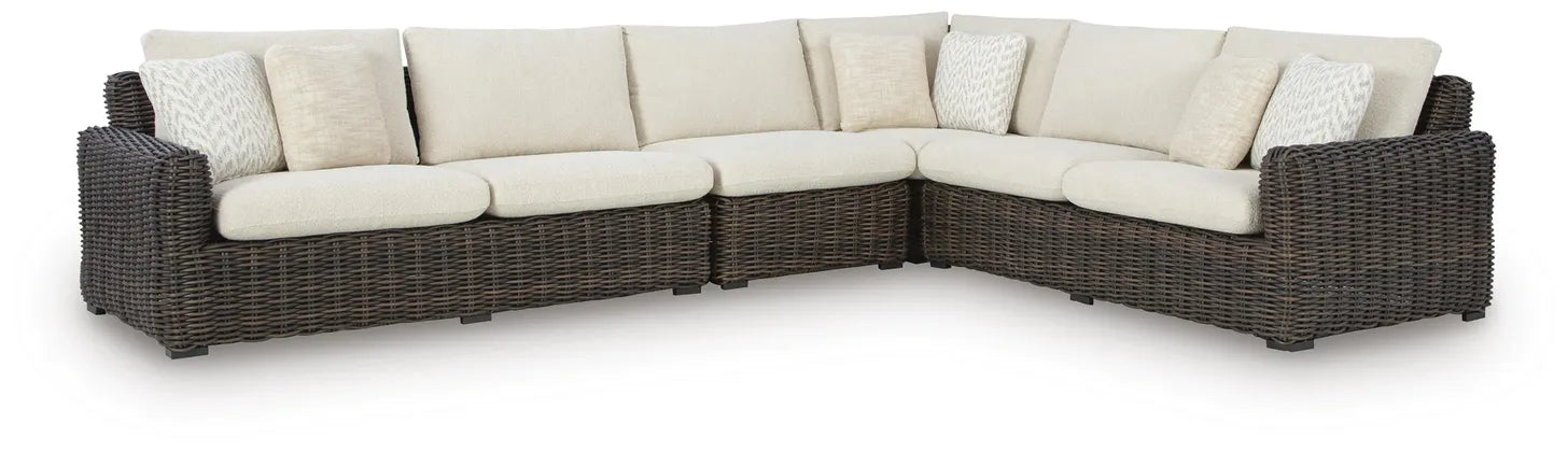 L-shaped outdoor sectional sofa, dark wicker with beige back cushions