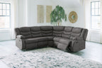 Slate gray reclining sectional sofa with chaise, padded arms, and tufted back cushions